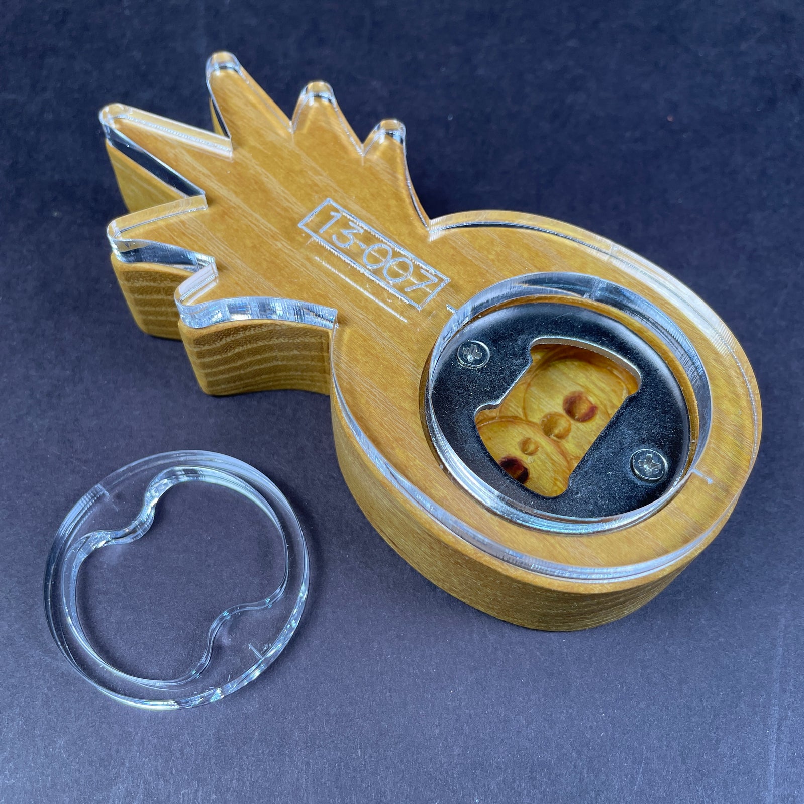 A preview photo showing 15 different styles of bottle openers on wood. Unique species and different themes will appeal to any beer drinker