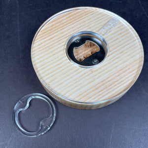 circle opener for your beer that is made from ash
