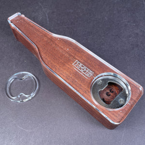 glass bottle of beer profile with a metal opener fastened to the bottom to open any beer cap that is not a twist off