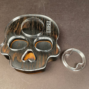 skull bottle opener that is great for any gothic theme or halloween party. Piece of wood looks burnt but is actually tiger wood that has naturally dark stripping